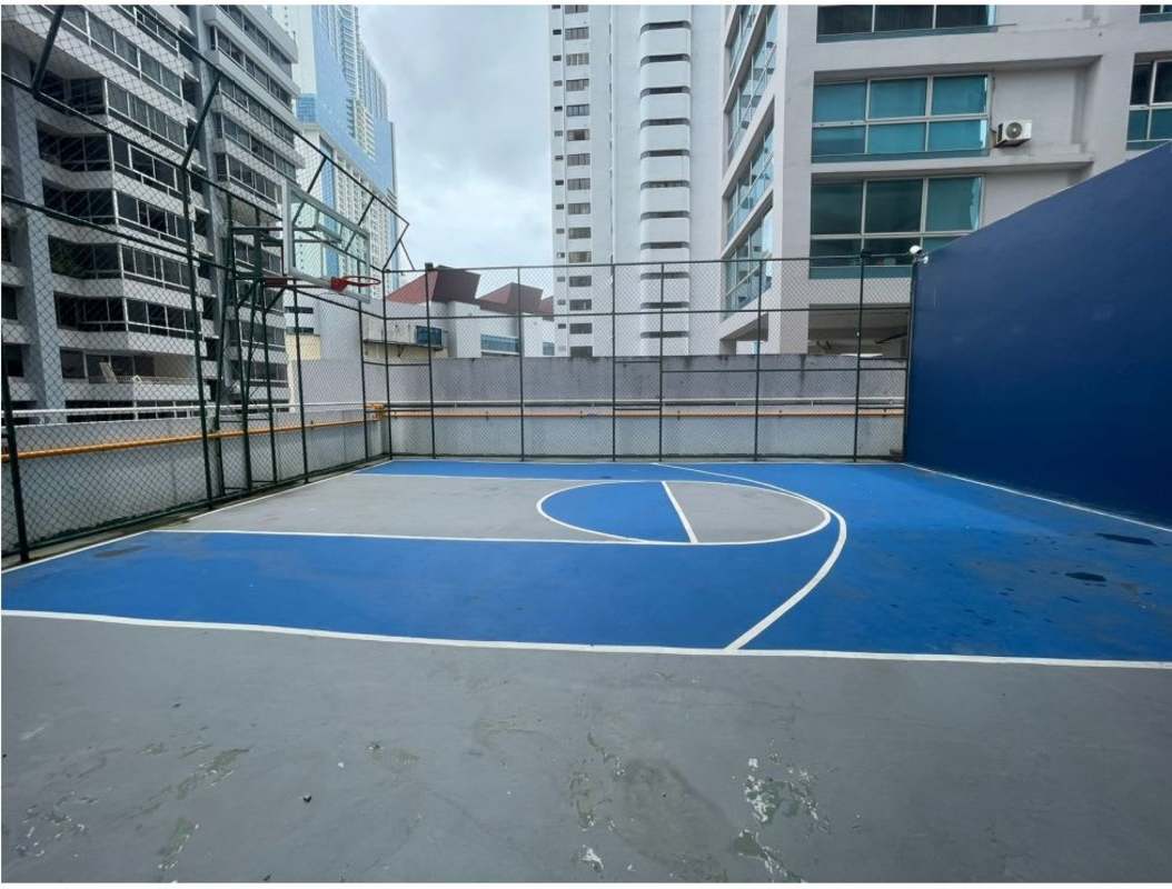 Outdoor basketball court with skyline backdrop PH Los Delfines Avenida Balboa Panama