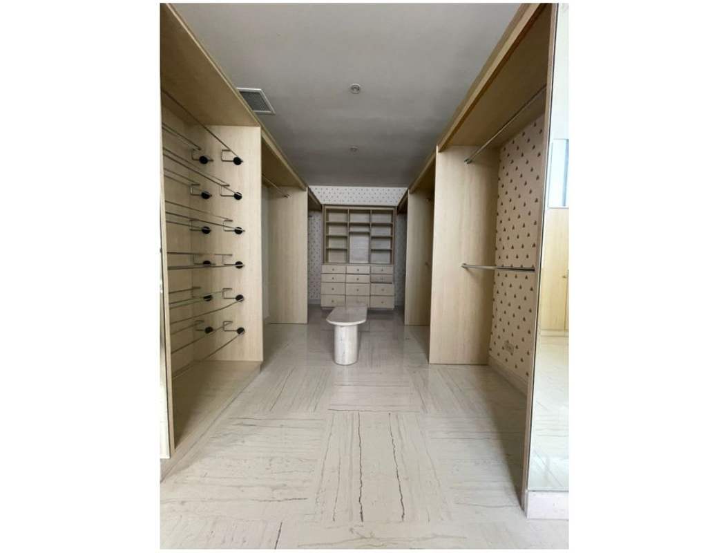 Luxury living room with marble floor, ocean and skyline views in PH Los Delfines Panama