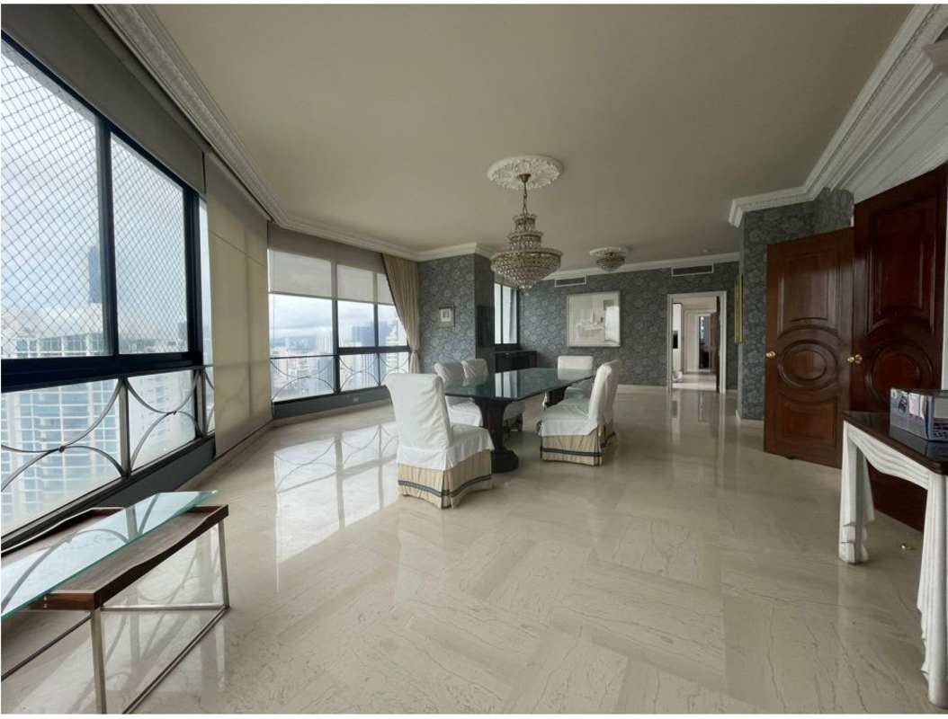 Spacious master bedroom with marble floors and panoramic ocean views at PH Los Delfines Panama City