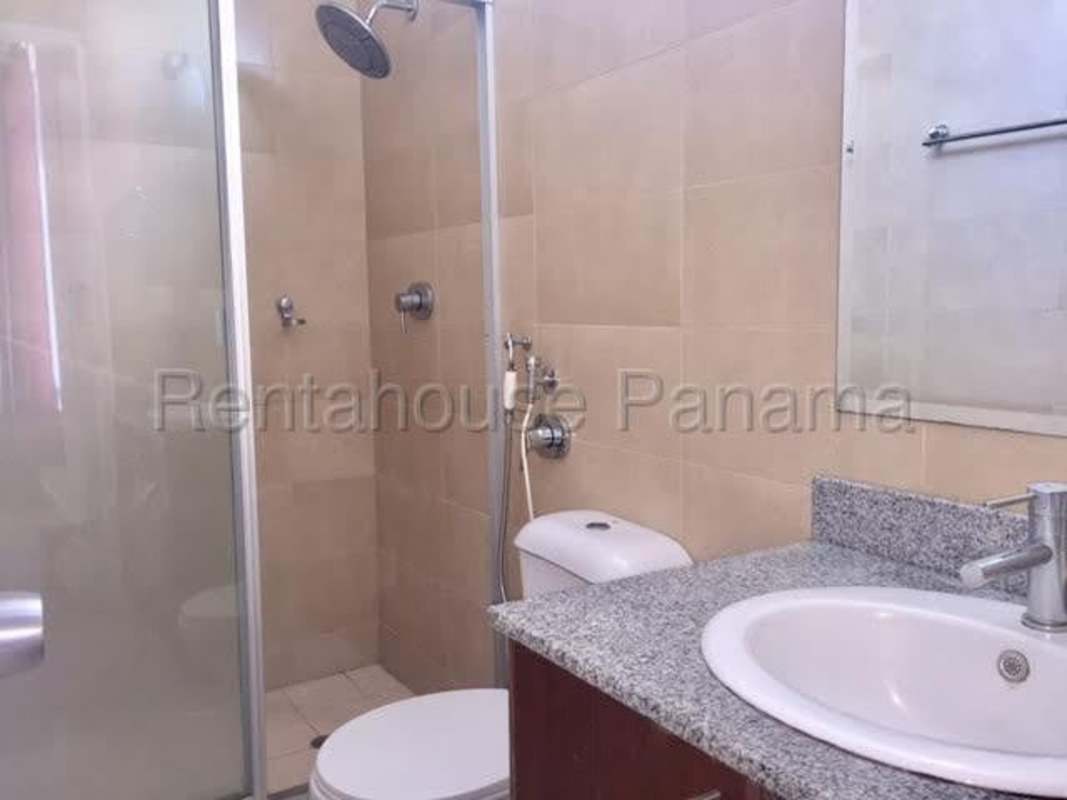 Modern bathroom with glass shower door and granite vanity in Costa del Este Panama
