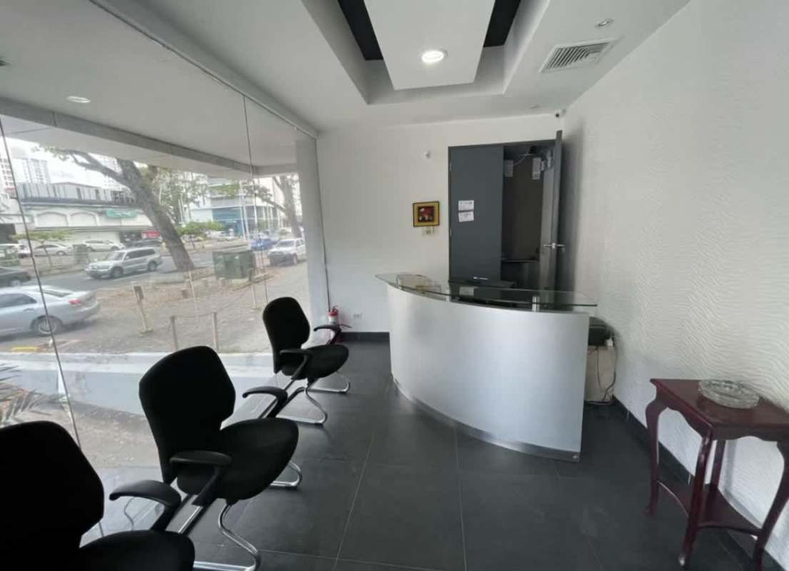 Curved glass reception counter with natural light and street view in Obarrio Panama commercial property
