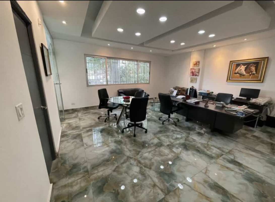 Executive office with marble floors, multiple desks, glass wall, and city views Obarrio Via España Panama