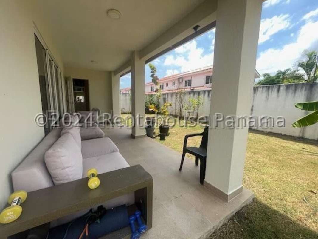 Modern staircase with metal railings and bright hall in rented house at Residencial Versalles Panama