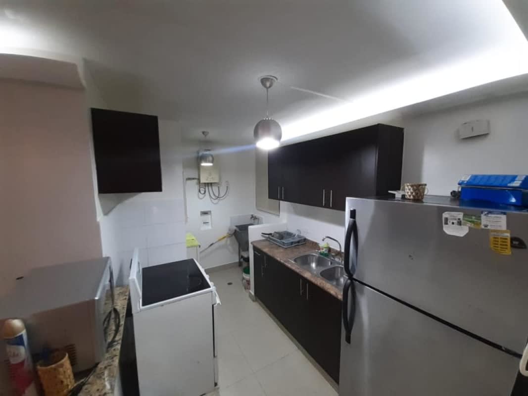 Kitchen granite countertop refrigerator microwave PH Condado Gardens Panama