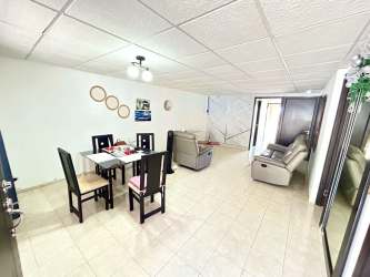 Terrace with coastal view, tiled floor and seating area in house Puerto Caimito