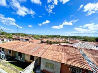 Open-plan living dining room with tiled floors in Puerto Caimito house for sale