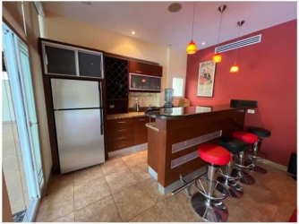 Spacious gourmet kitchen with granite countertops, island, stainless appliances at luxury villa Panama