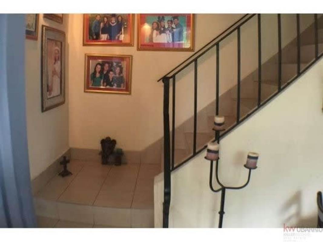 Modern bathroom with double sink vanity, glass shower, tile walls in Diablo Heights Panama