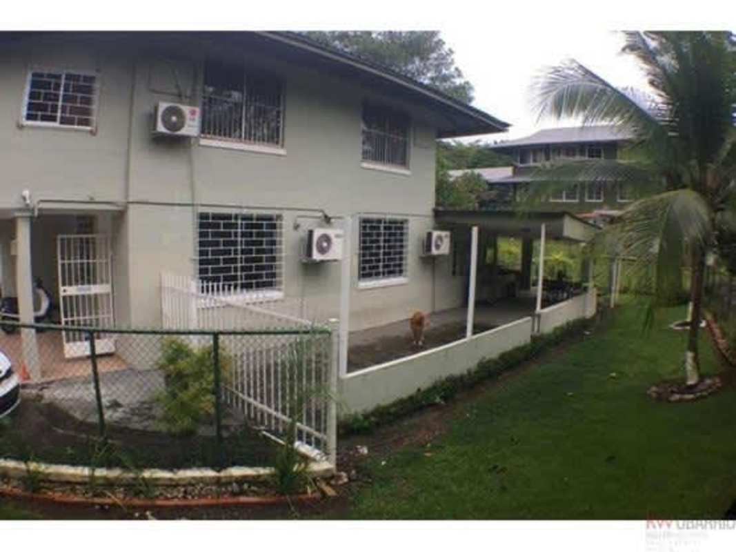 Traditional bedroom with blue curtains, bed, air conditioning Diablo Heights Panama