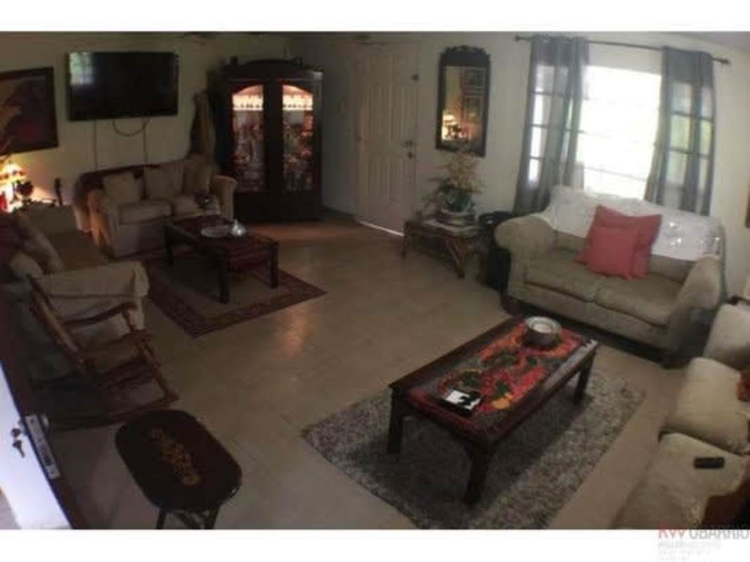 Living dining open space beige tile bright windows Panama Diablo Heights