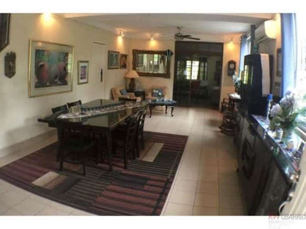 Bathroom with double sink vanity, large mirror, beige tile walls Diablo Heights Panama