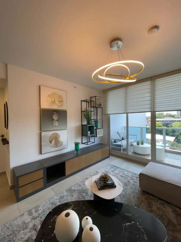 Bright living room with panoramic balcony access at PH Van Gogh El Cangrejo Panama City