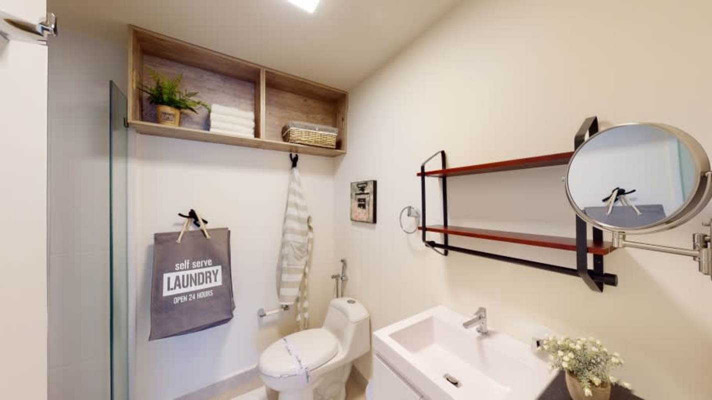 Contemporary bathroom with glass enclosure, sleek vanity and designer tiles at PH Armonía