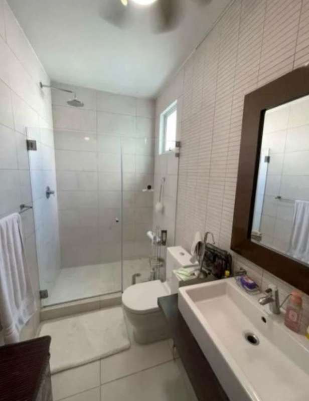 Contemporary bathroom with walk-in glass shower, vanity, bright design in luxury house San Francisco Panama