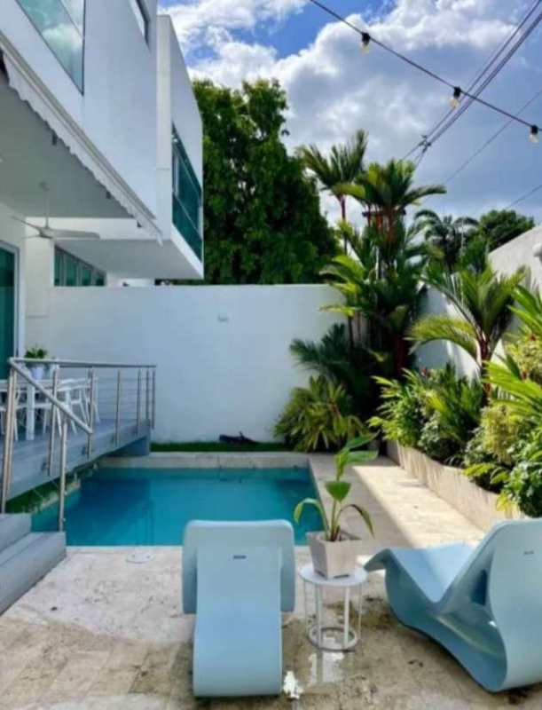 Private terrace with pool, BBQ, greenery, string lights modern home Panama City