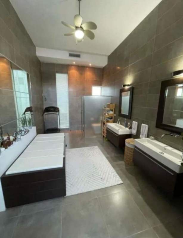 Spacious master bathroom with soaking tub, double sinks, walk-in shower, treadmill in San Francisco house Panama