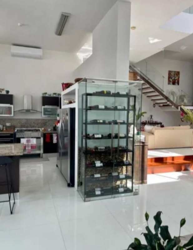 Modern kitchen with granite counters, floating stairs, glass wine storage, open layout Panama City rental