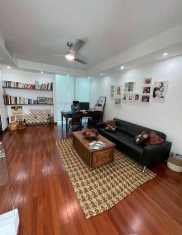 Open concept living room with sofa, coffee table, home office desk hardwood floors Panama house rental