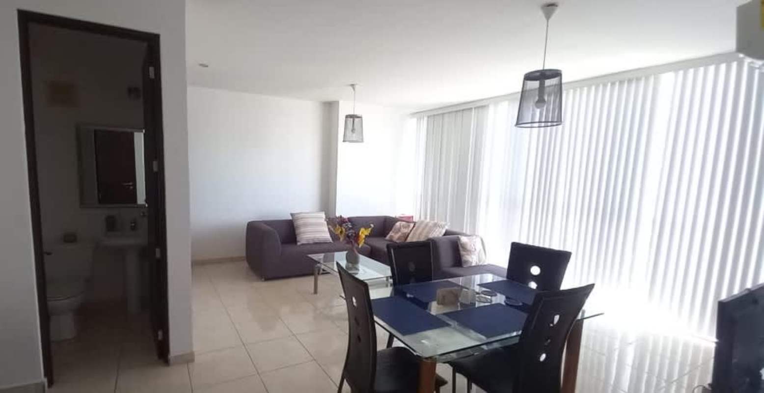 Bright living dining area with tile flooring, large windows, and views PH Sky Blue Tower Panama