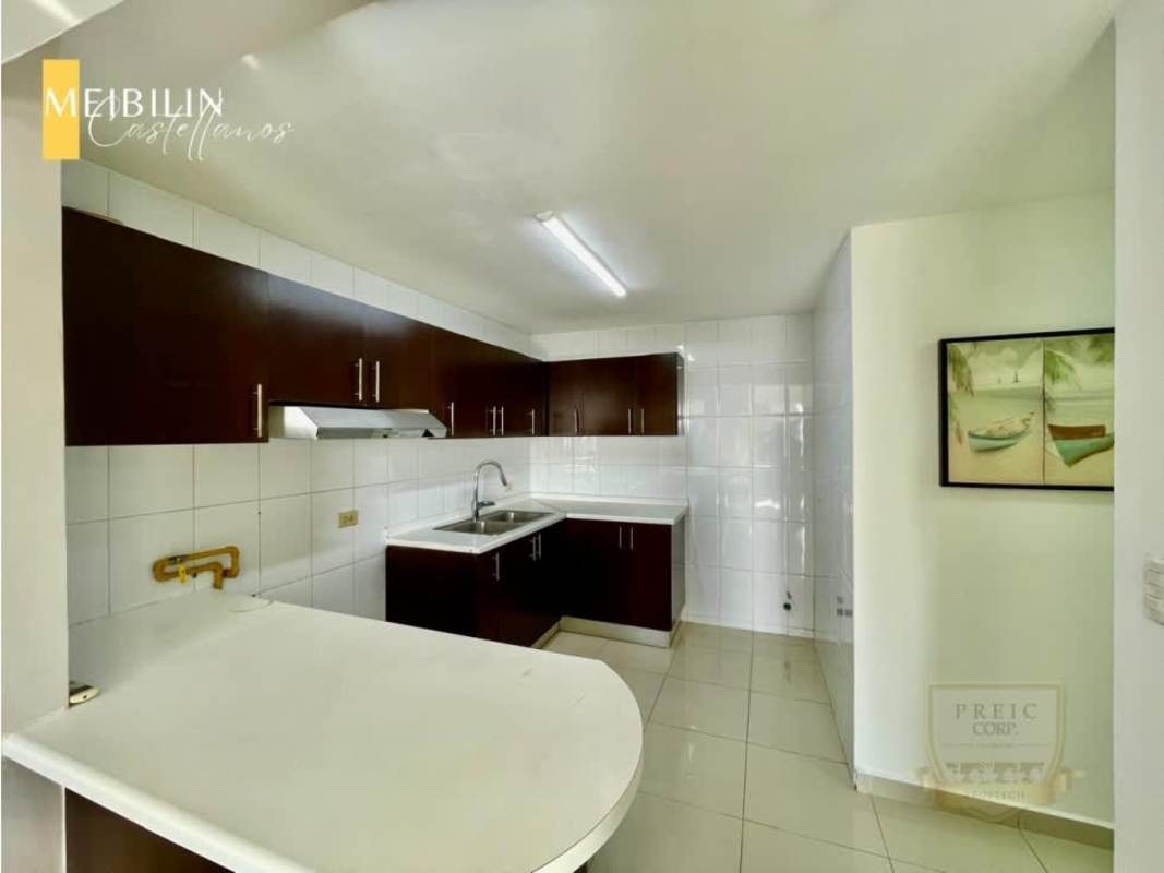Contemporary kitchen with dark cabinetry, tile backsplash, and ventilation at PH Sky Level Panama City
