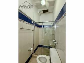 Bedroom with exposed beams, ceiling fan, AC rustic style APPRUC Coronado duplex beach home