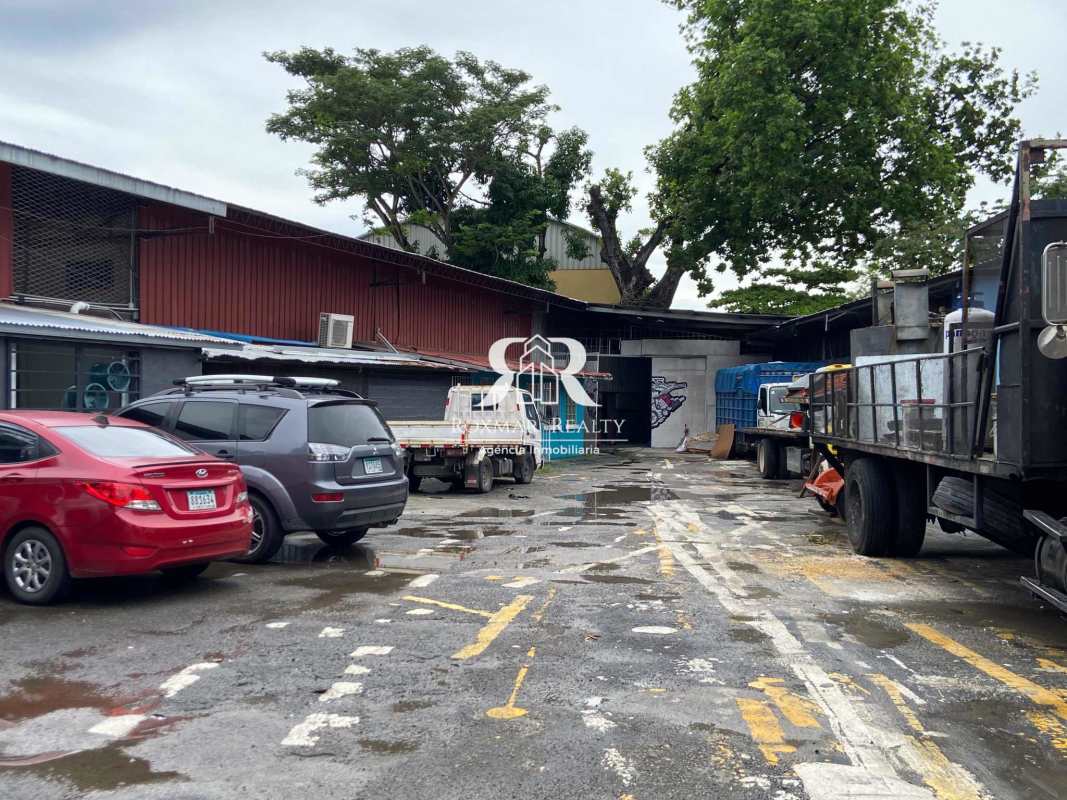 Parking lot with commercial vehicles in front of industrial warehouse Parque Lefevre Panama