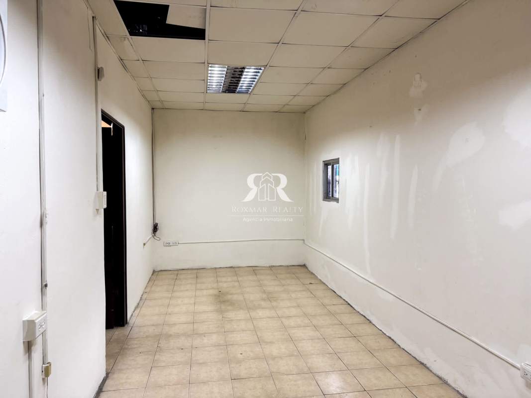 Bathroom with pedestal sink and toilet inside commercial warehouse in Parque Lefevre Panama