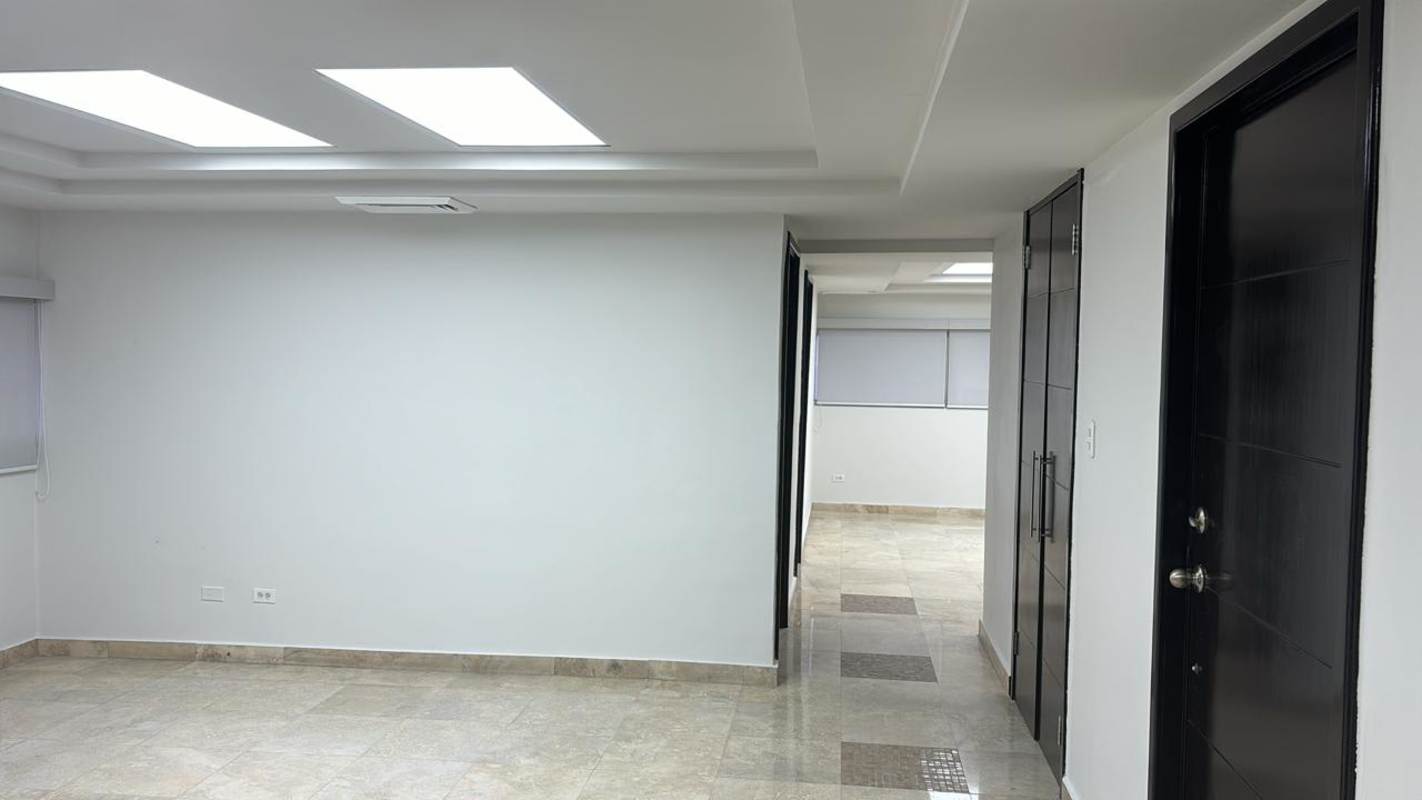 Interior corridor of commercial office with tile floors, drop ceiling, and neutral walls in Obarrio Panama