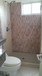 Modern bathroom in Panama house with granite sink, mirror and shower Vista Alegre Arraiján