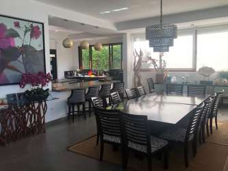 Covered outdoor gazebo with BBQ bar and dining area in beachfront villa Playa Coronado Panama