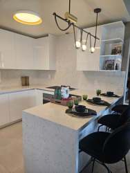 Modern dining area with glass table and garden views Casa Explora Panama Pacifico