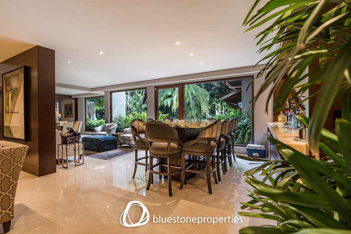 Luxury dining room high ceilings chandelier garden views mansion Altos del Golf Panama City