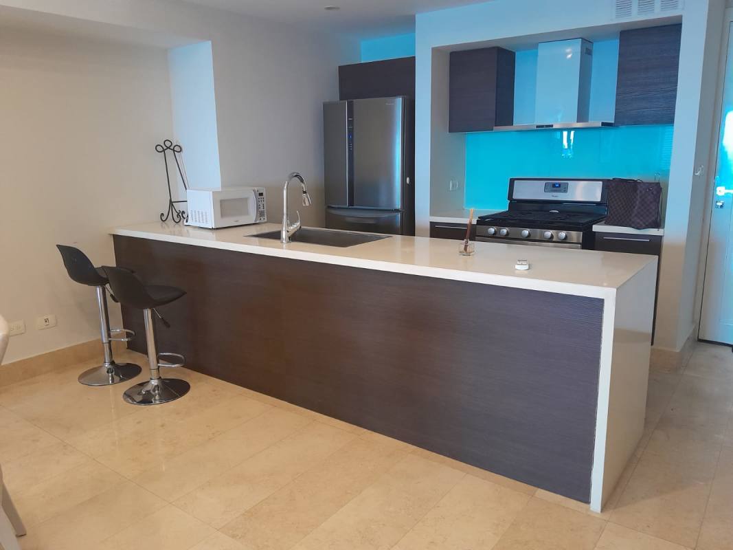 Modern kitchen with blue backsplash, island, bar stools PH YOO Panama