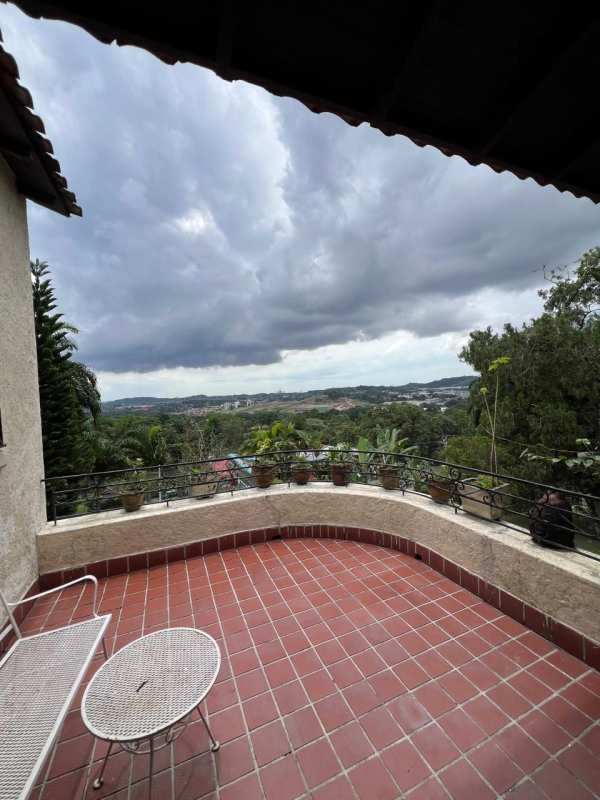 Traditional bright kitchen with cabinets, window and appliances in Las Cumbres Panama house