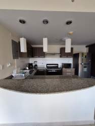 Fully equipped kitchen with granite counters, appliances, porcelain floor apartment rental Panama Pacifico