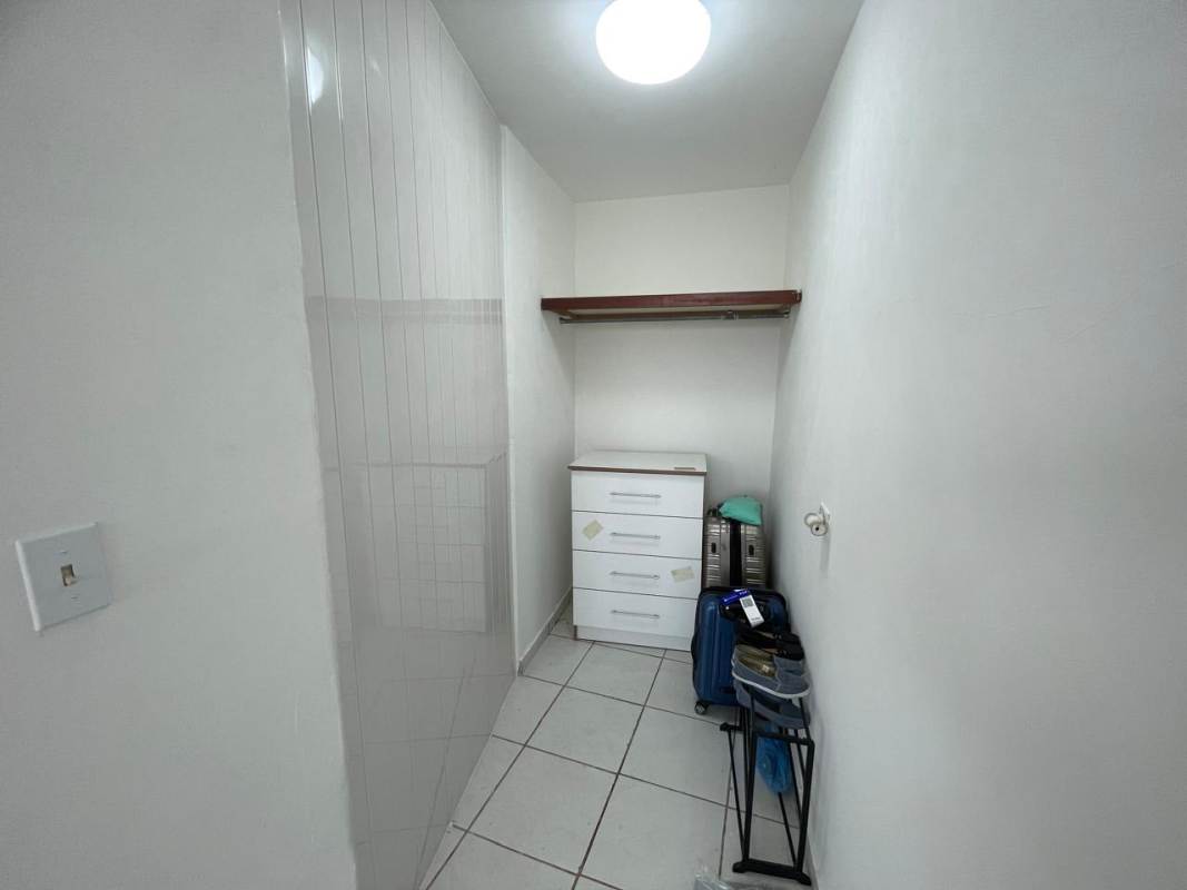 Bathroom with walk-in shower, pedestal sink, tile walls in PH Beverly Hills Betania Panama City