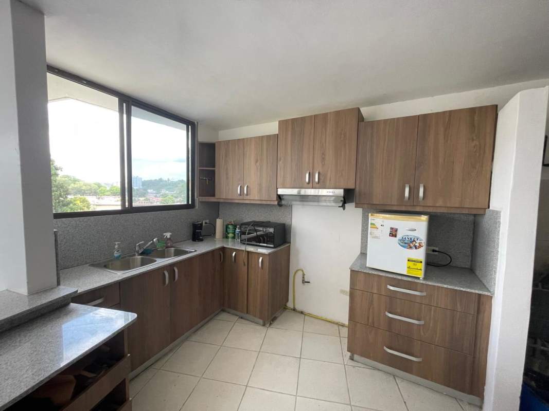 Empty bedroom with white tiles, built-in closet and city view at PH Beverly Hills Betania Panama City apartment for rent