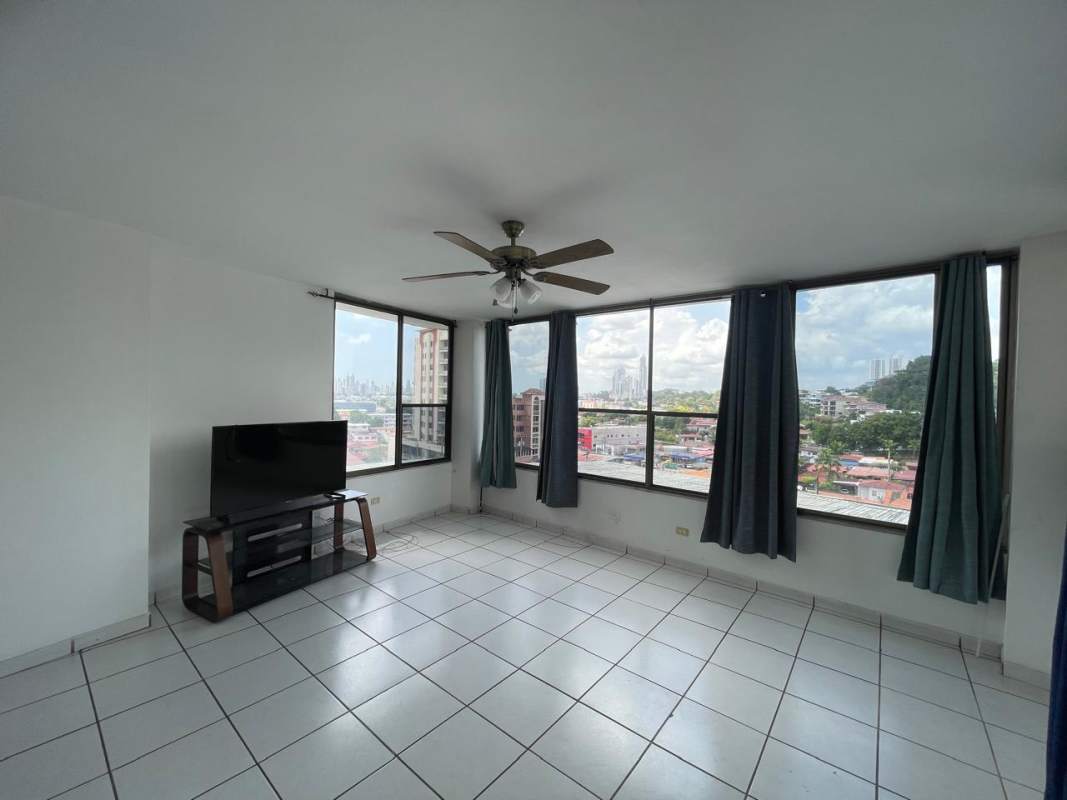 Kitchen with granite counters, wood cabinets, large window and appliances in PH Beverly Hills Betania Panama City