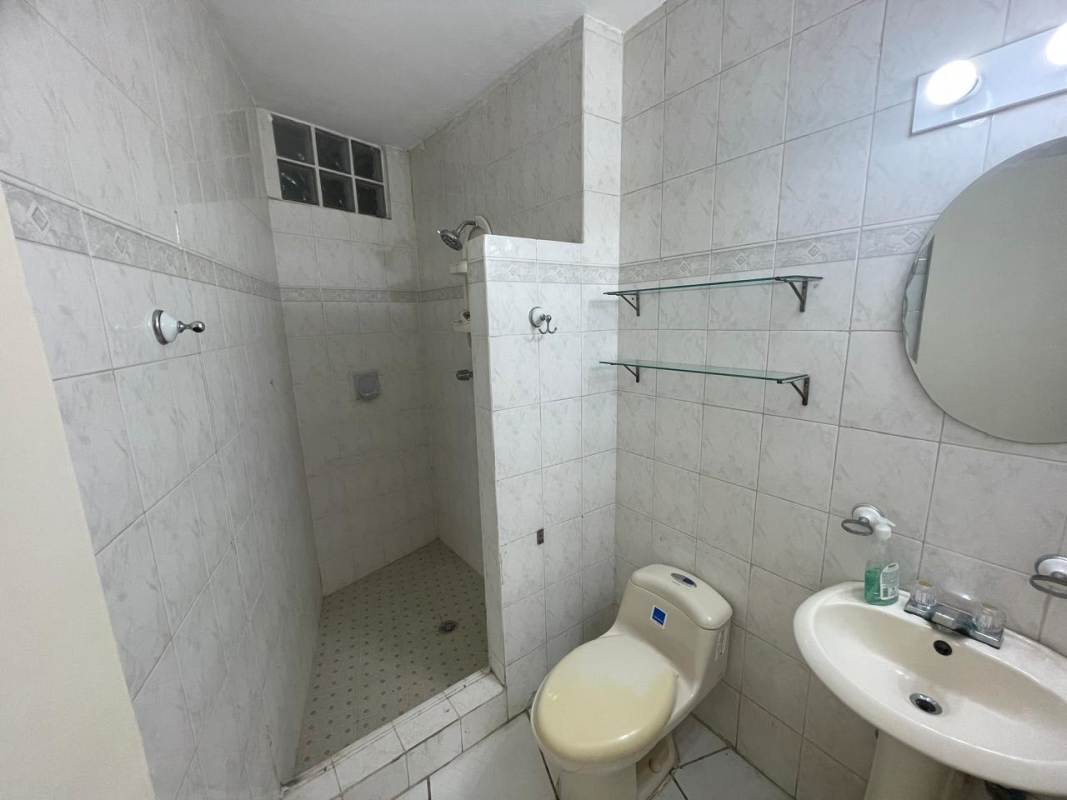 Simple traditional bathroom with shower and pedestal sink at PH Beverly Hills Betania Panama City