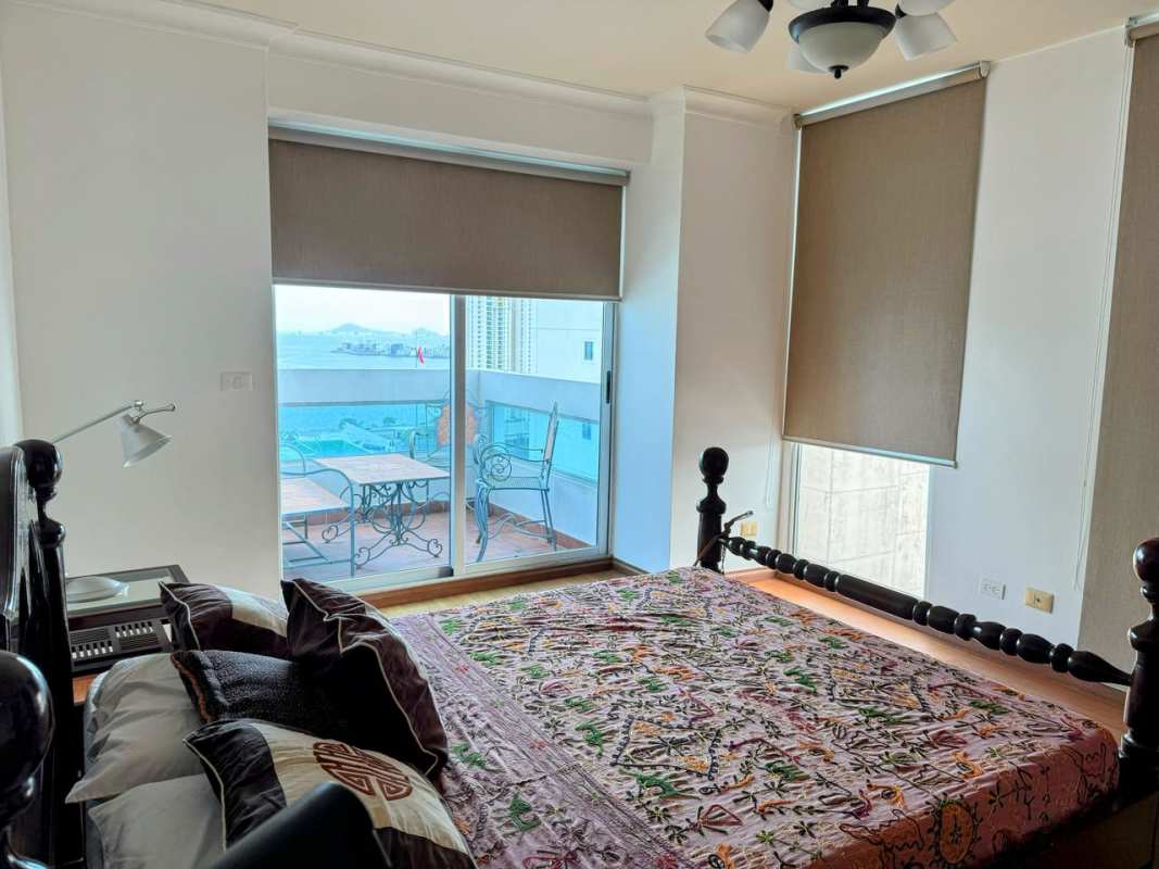 Elegant bathroom with modern fixtures, vessel sink, and glass shower PH The View Panama City
