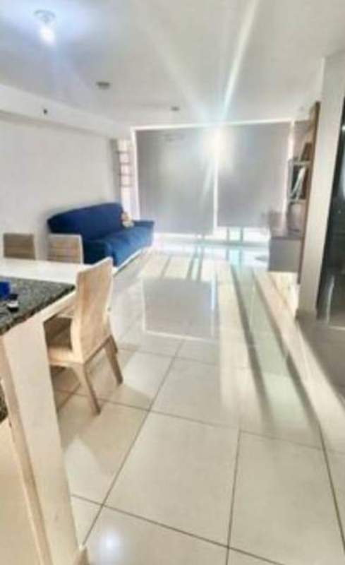 Open plan living and dining room with tiled floor natural light balcony PH Carrasquilla Panama