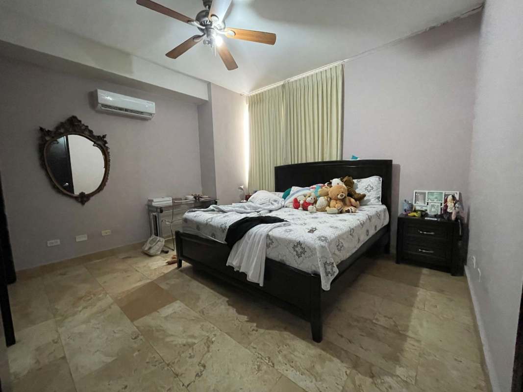 Elegant living space with marble tiles, ceiling fans and balcony access PH Premier Loft