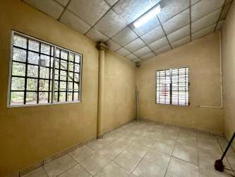 Bedroom with ceramic tiles and secure windows in Volcán Chiriquí house