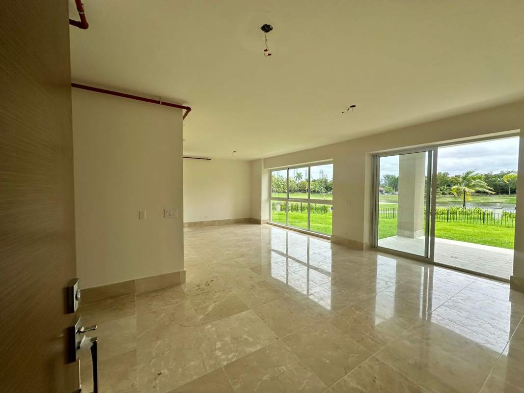 Elegant master bedroom with marble floors and access to garden terrace in The Reserve Santa Maria Panama City