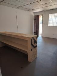 Entryway with wooden counter and security bars at rental apartment Arraiján Panama