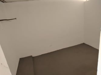 Bathroom with shower curtain and geometric tiles in affordable apartment Vista Alegre Arraiján Panama