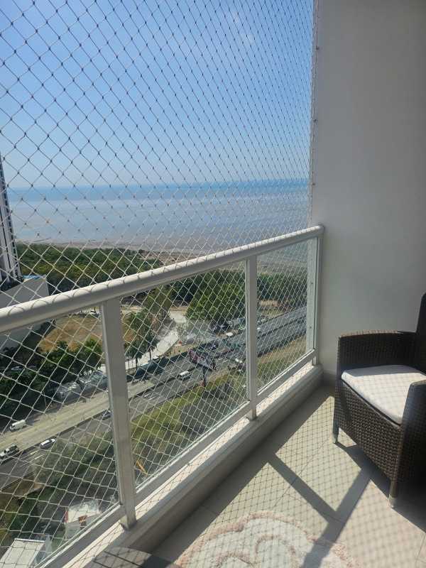 Balcony enclosed with safety net overlooking ocean and skyscrapers in PH Asia Costa del Este
