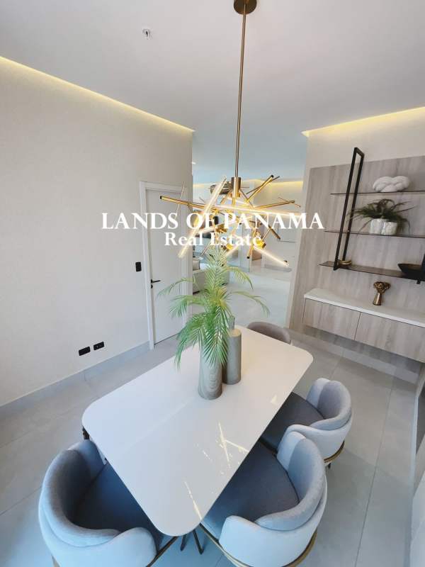 Bright bedroom with large window and city skyline view in luxury Punta Paitilla apartment