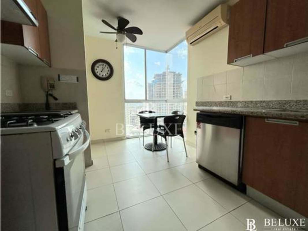 Bedroom with large windows, air conditioning, city skyline views in PH Solaris Panama