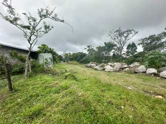 Open grassy farmland with some rocks Volcán Tierras Altas Panama